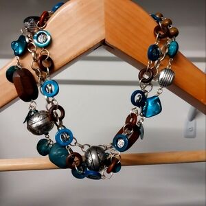 Bundle of 2 layered necklaces. One silver and gray. One silver, brown,teal/aqua